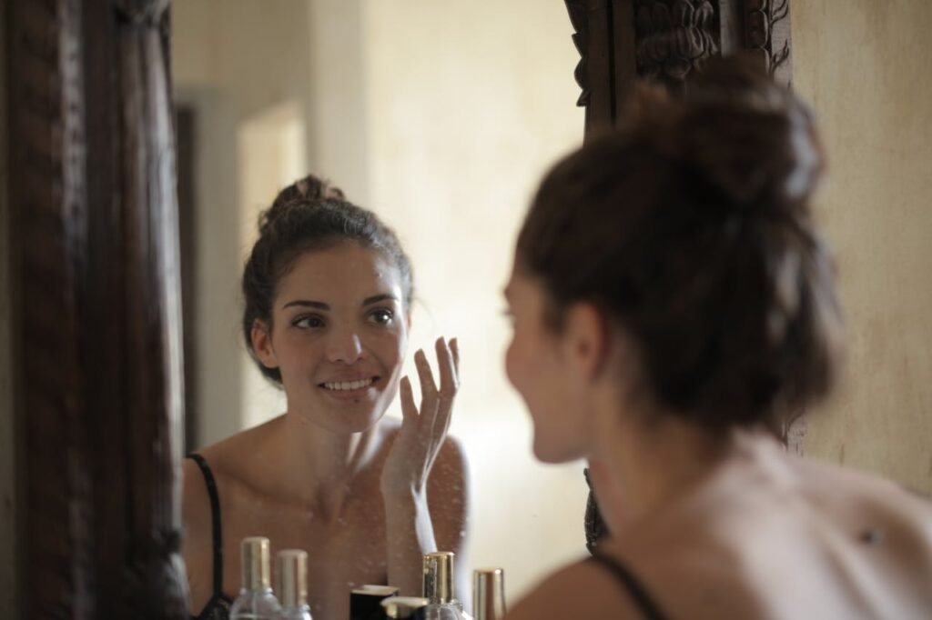 Marine collagen vs bovine collagen: girl looking in mirror