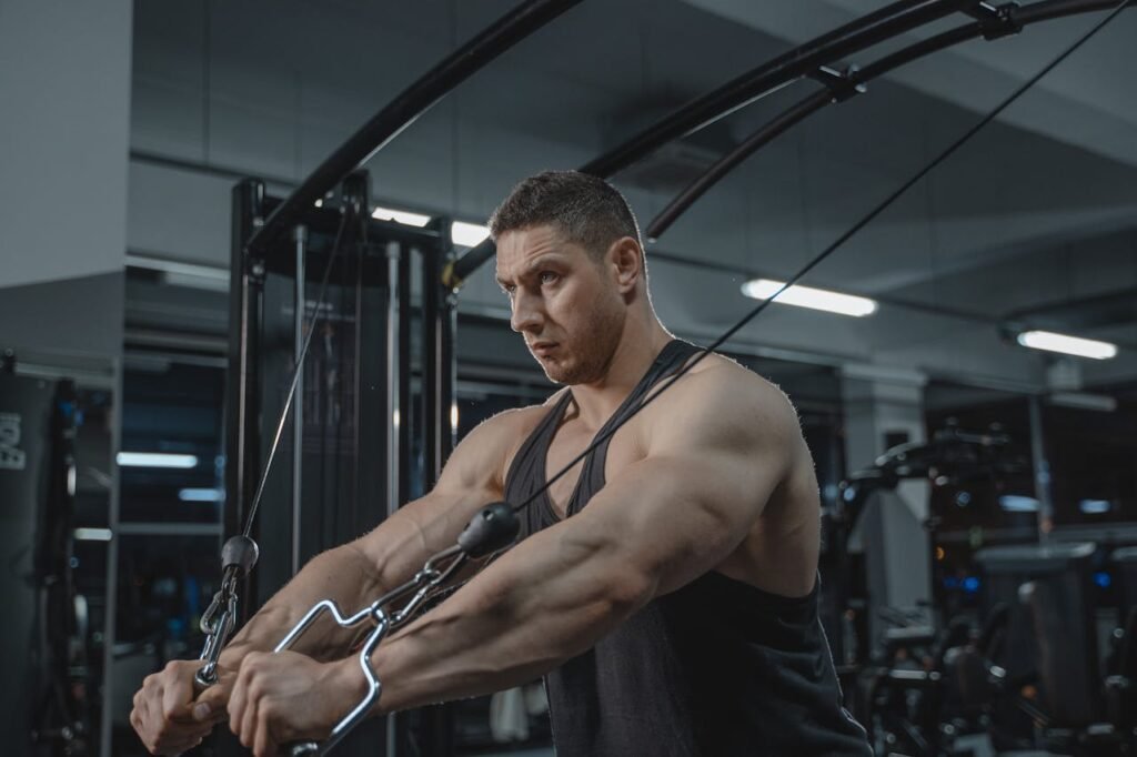 Functional trainers: man using machine 
