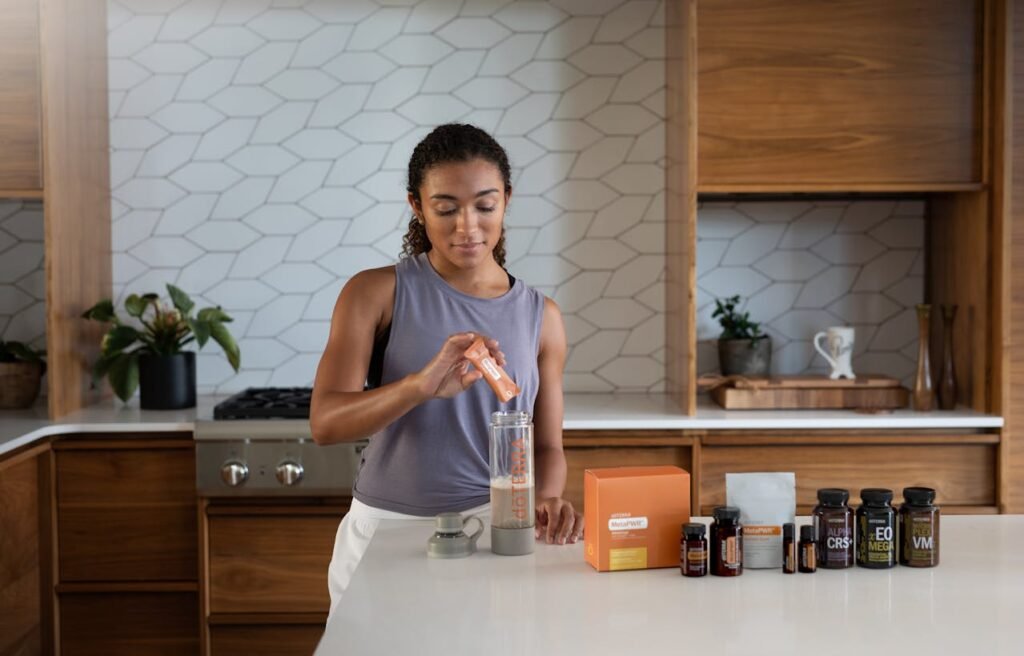 Pre workout: Girl pouring powder in cup 